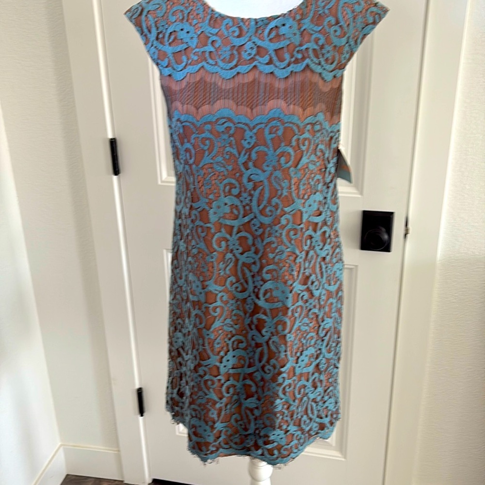 Gorgeous lace dress by Suzy Chin. New with tags. Size 2. 32” from shoulder/hem.
